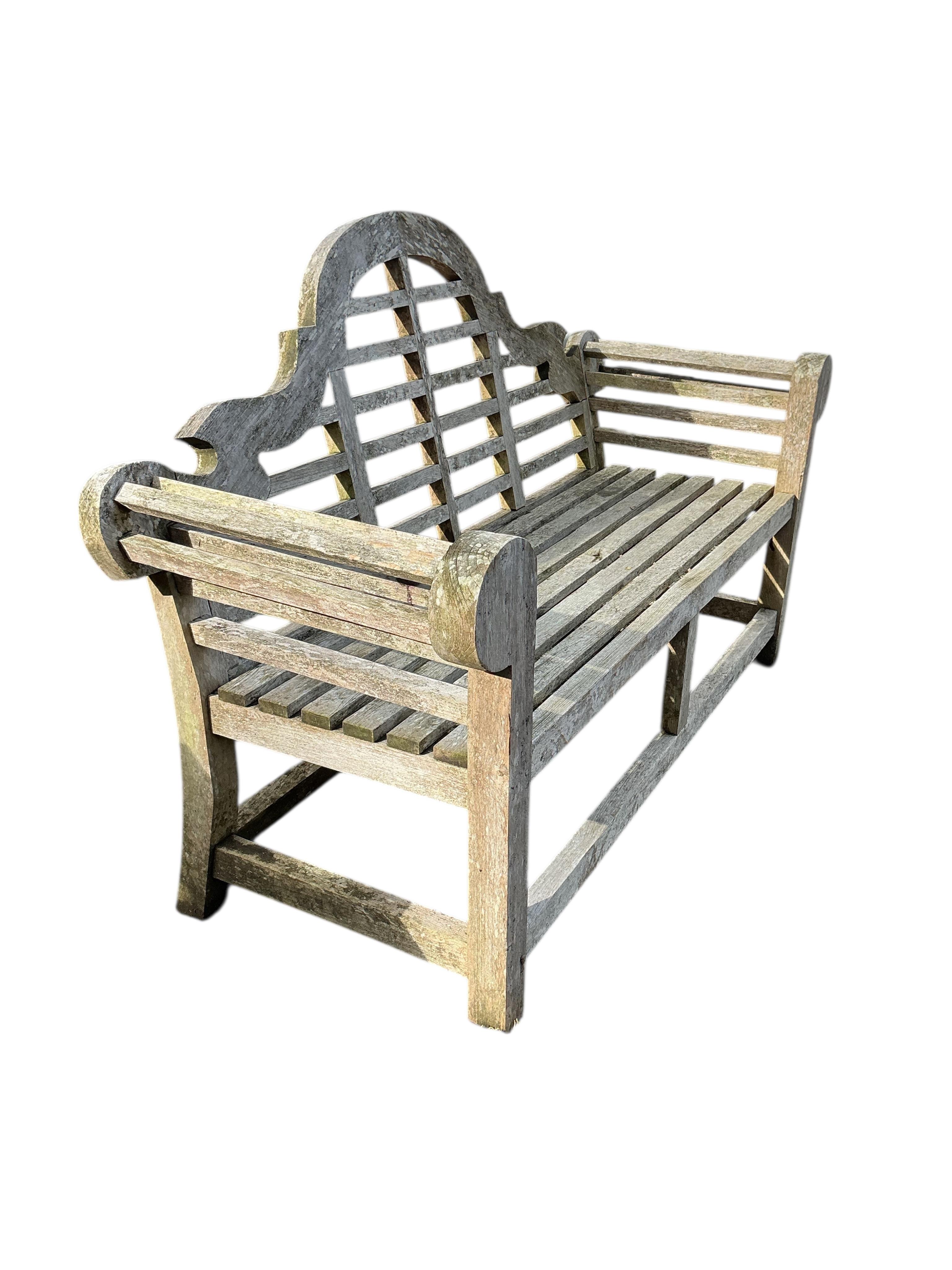 A Lutyens style weathered teak garden bench, width 168cm, depth 55cm, height 106cm